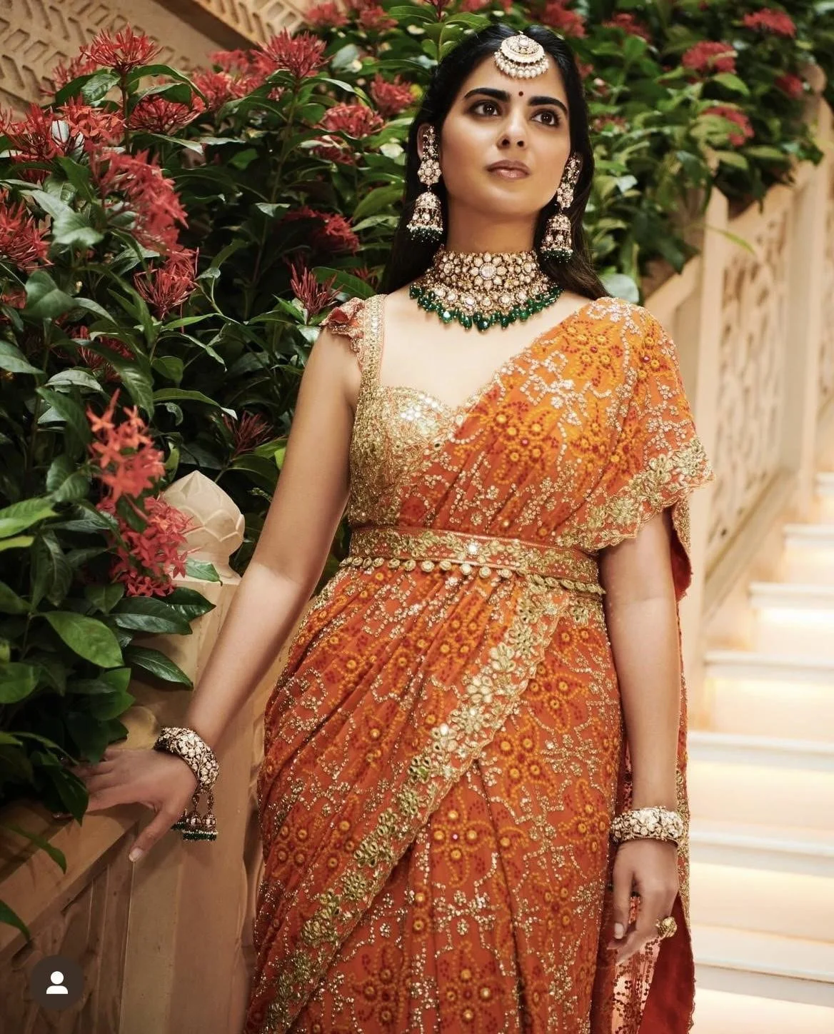 Alia bhatt in an orange bridal ensemble. - image 1